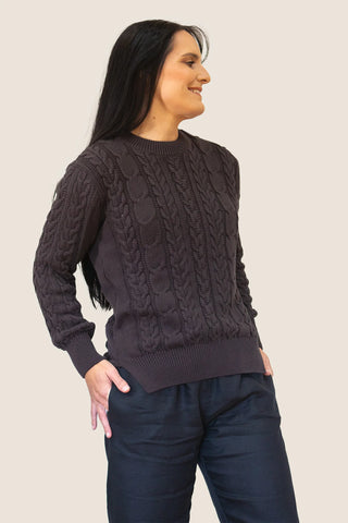 DE TIAMO Cable Knit Sweater in chocolate — front view showing intricate cable pattern and round neckline