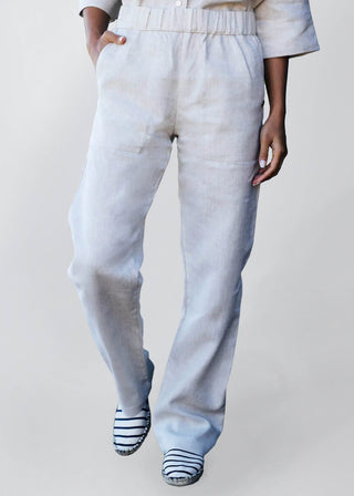 DE TIAMO Breeze Linen Pants in natural — front view showing draped wide-leg silhouette and drawstring waist