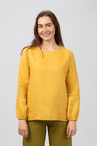 DE TIAMO Cleo Long Sleeve Top in turmeric — front view, warm seasonal linen colourway with elasticated cuffs