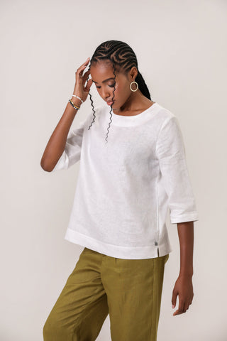 DE TIAMO Cleo Linen Top in white — front view showing relaxed unstructured linen silhouette