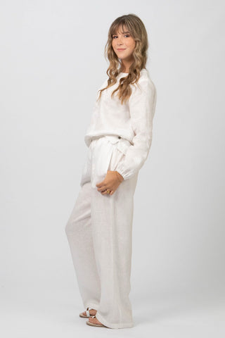 DE TIAMO P-1 Wide-Leg Linen Pants in white — lifestyle shot showing contemporary longer wide-leg length on model