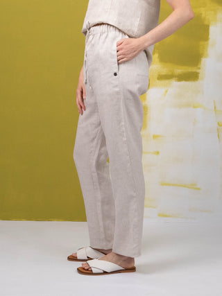 DE TIAMO Paloma Linen Tapered Pants in natural — lifestyle shot, casual smart everyday summer styling