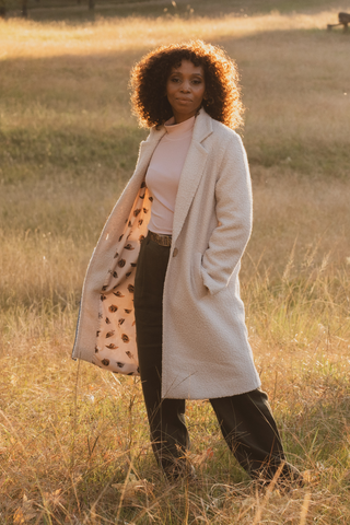 DE TIAMO Revere Coat in bone — front view showing tailored revere collar and structured silhouette