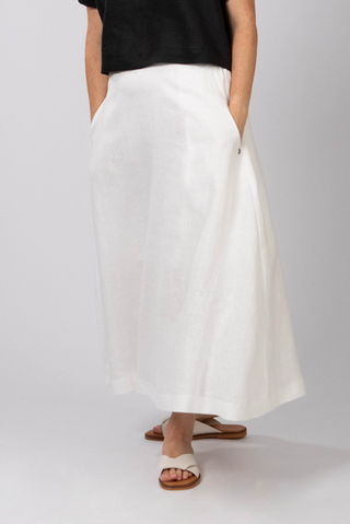 DE TIAMO Sophia A-Line Linen Skirt in white — full length front view showing elegant flare from natural waist