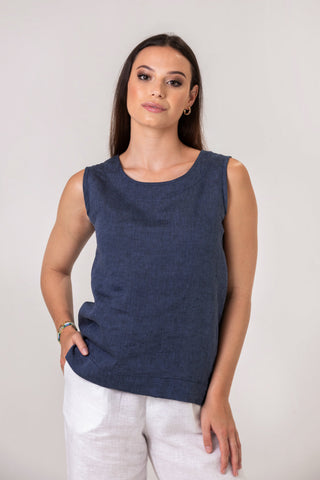 DE TIAMO Zina Linen Tank Top — lifestyle shot styled with white linen trousers, casual summer outfit